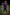 Person wearing a sports uniform with a logo on a soccer field